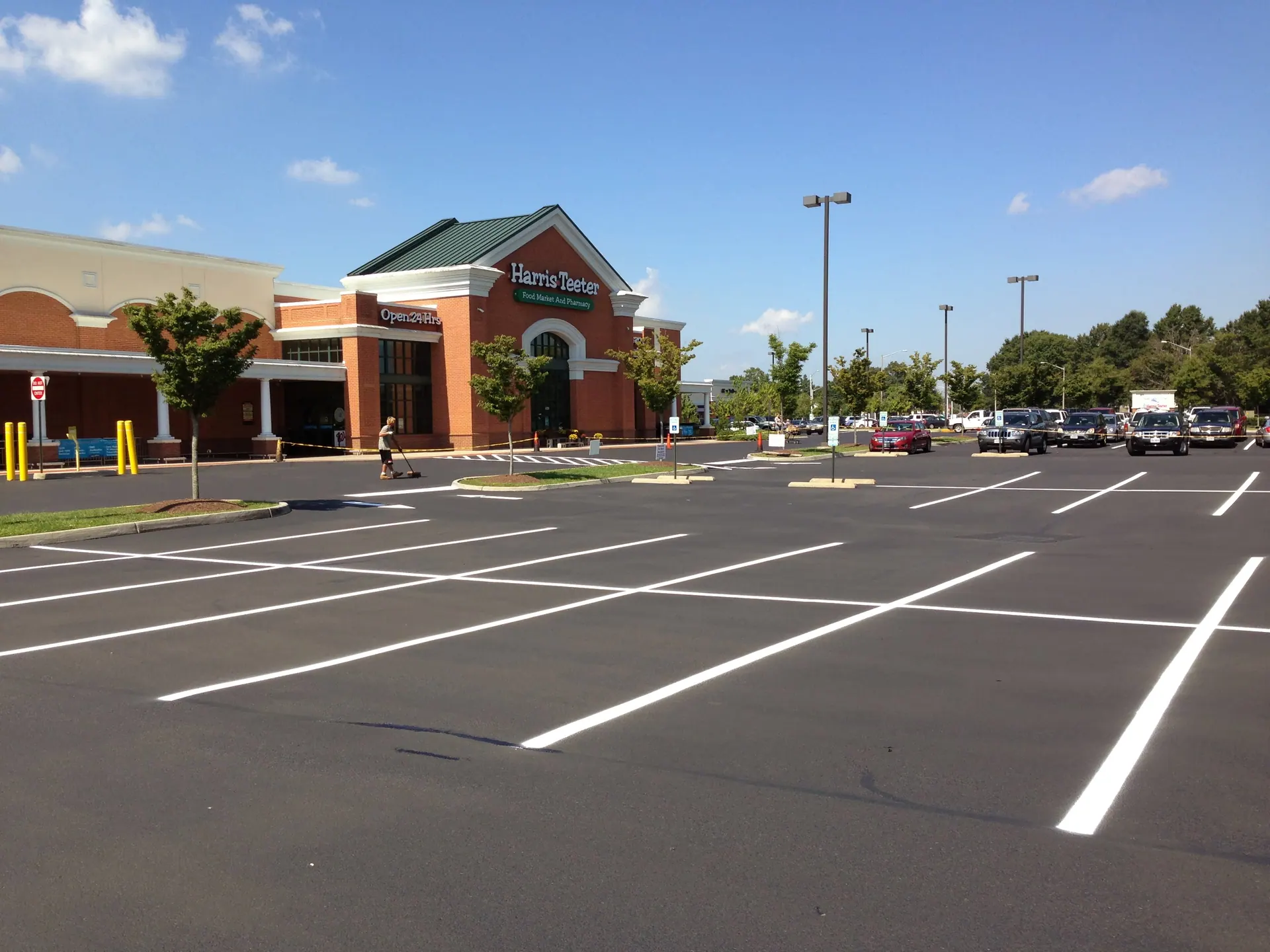 Grocery-anchor lot freshly sealcoated and striped