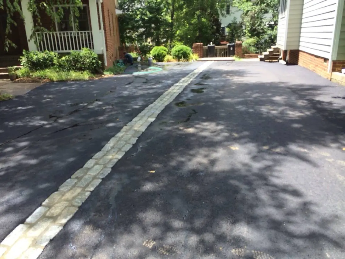 Driveway with a cobblestone center ribbon